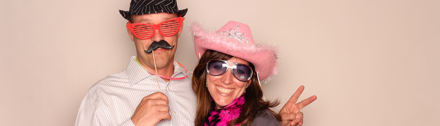 Photobooth fun with glasses, mustache and pink cowboy hat